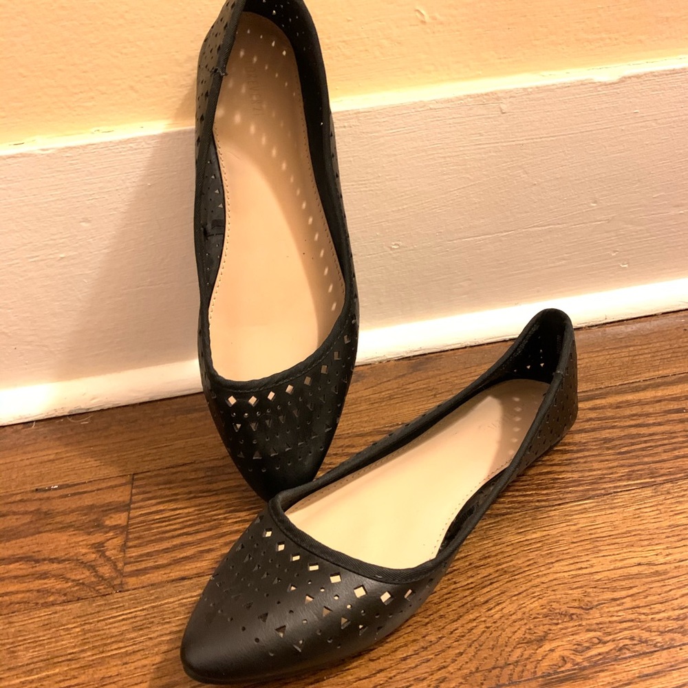 Black flats with shaped holes around it.
